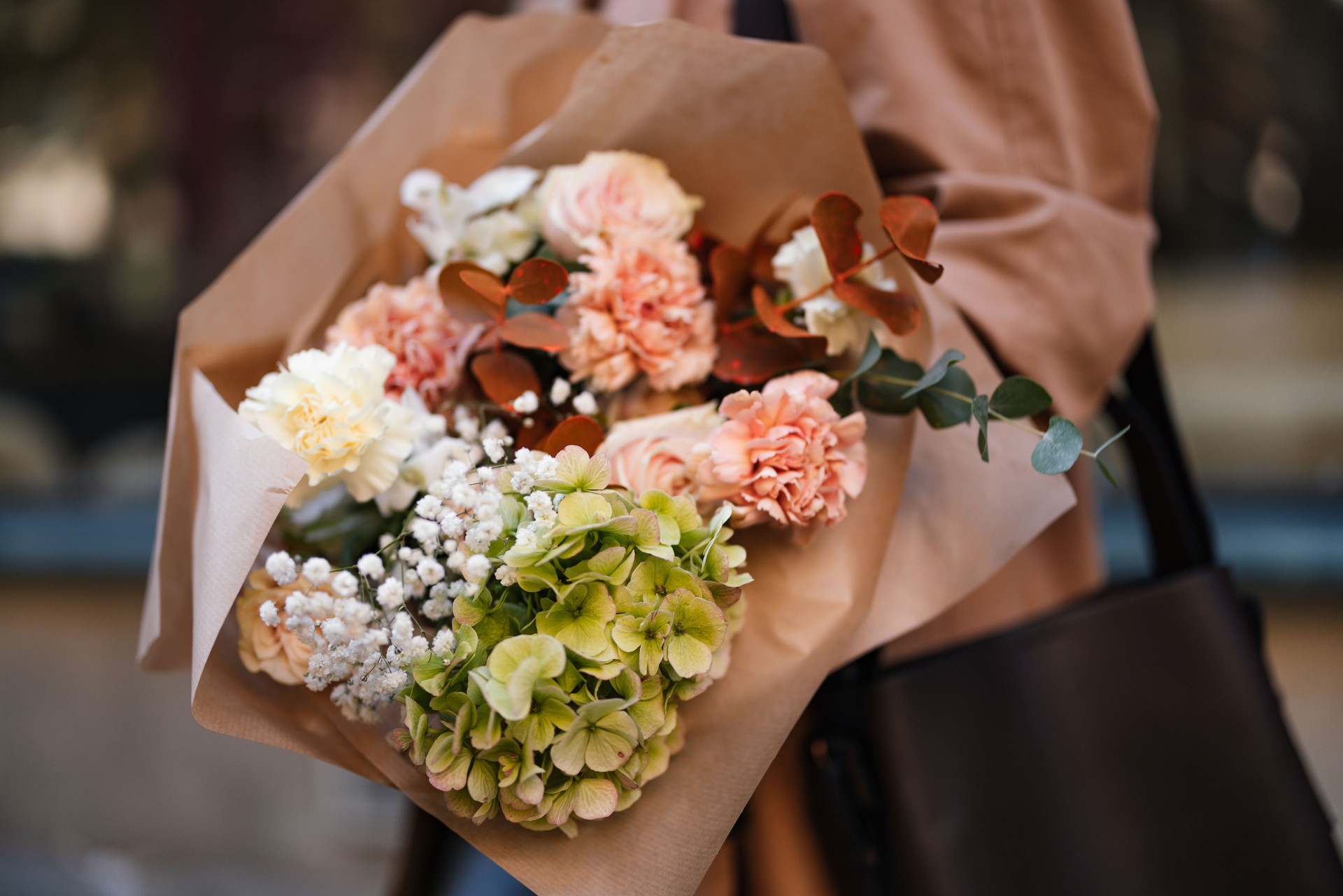 Beautifully Arranged Bouquet of Fresh Flowers in Neutral Paper Wrap